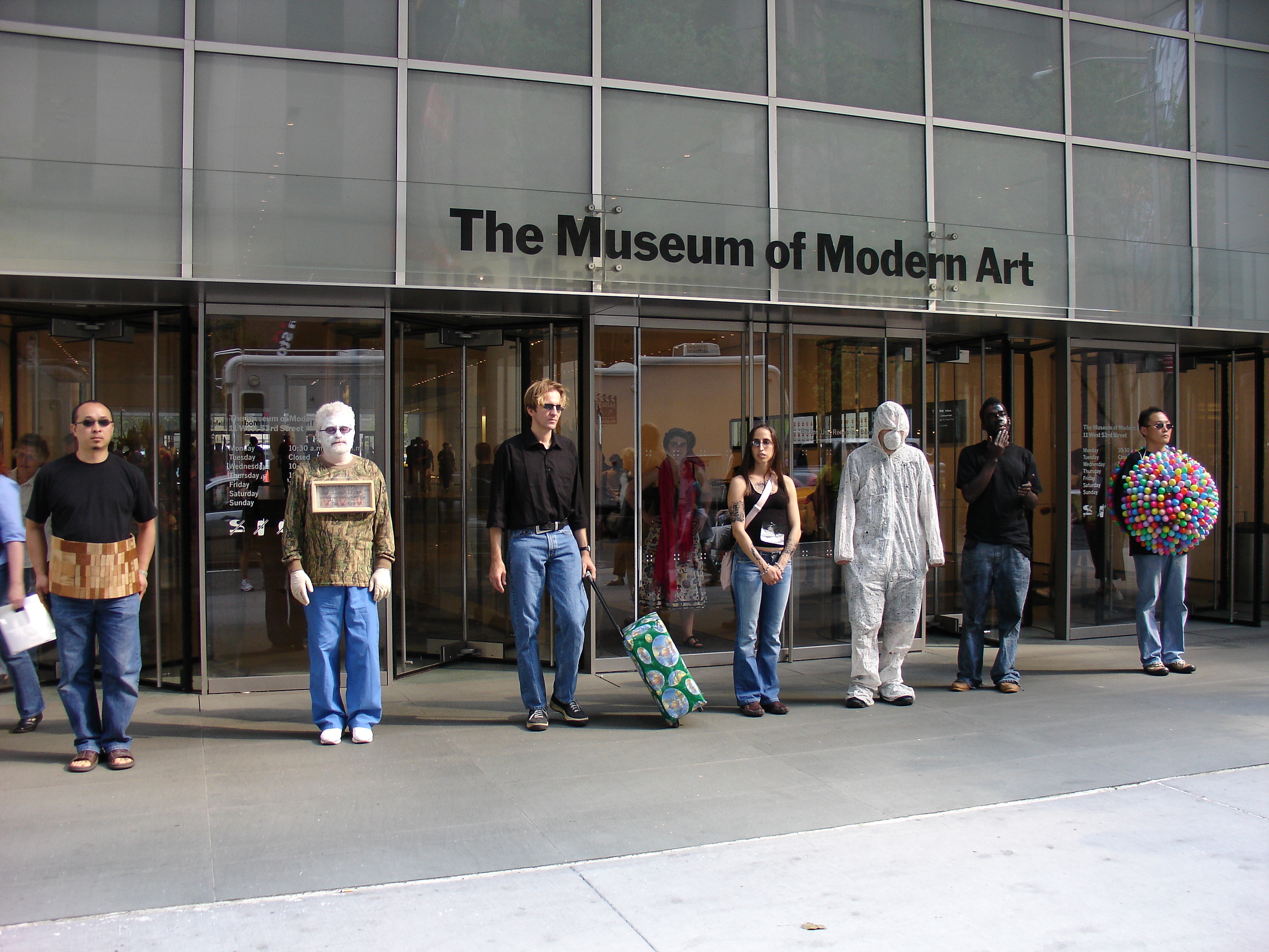 people standing outside museum
