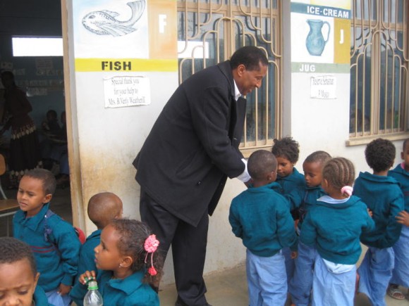 Michael Belay during recent visit to kindergarten he helped establish. Benefit concert planned Friday, Feb. 21, is aimed at helping to build another school in Belay's native Ethiopia.