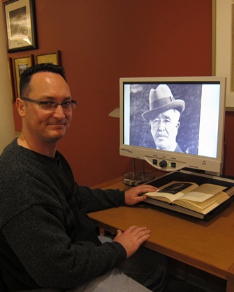 man smiling with computer