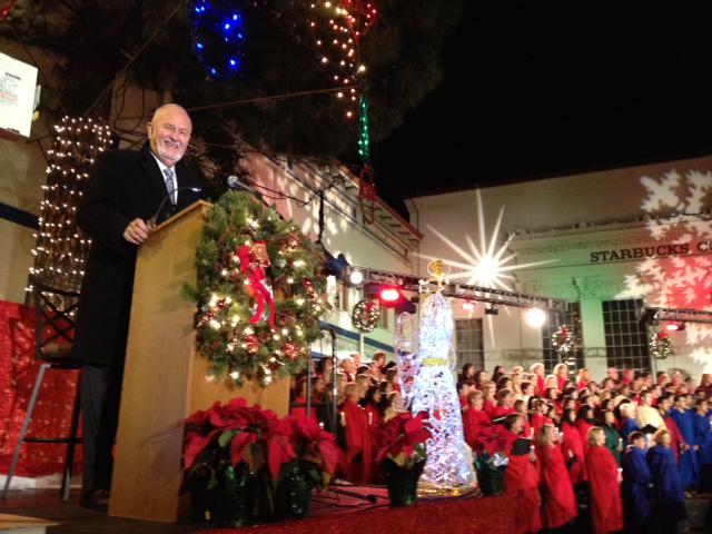 man smiling on holiday stage