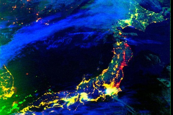 This NASA satellite image shows areas in Japan which experienced loss of electricity after the March 11, 2011 earthquake and tsunami. Yellow indicates lights that were functioning in both 2010 and 2011. Red indicates power outages detected on March 12, 2011.