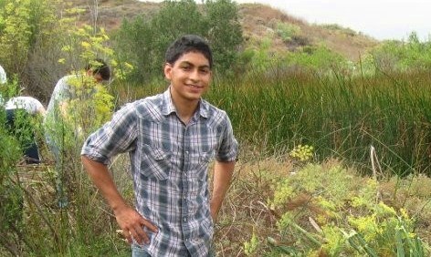 Angel Flores '13 has been named a Udall Scholar. He's pictured here at a university habitat restoration project run in partnership with the California Coastal Commission.