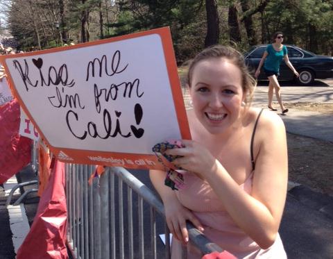 A wellesley student offers race-day encouragement.