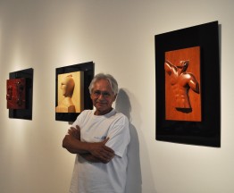 Artist Nicholas Hernandez, who was awarded an Honorary Doctor of Arts at Commencement 2012, with some of his sculptures on exhibit now at the Guggenheim Gallery.