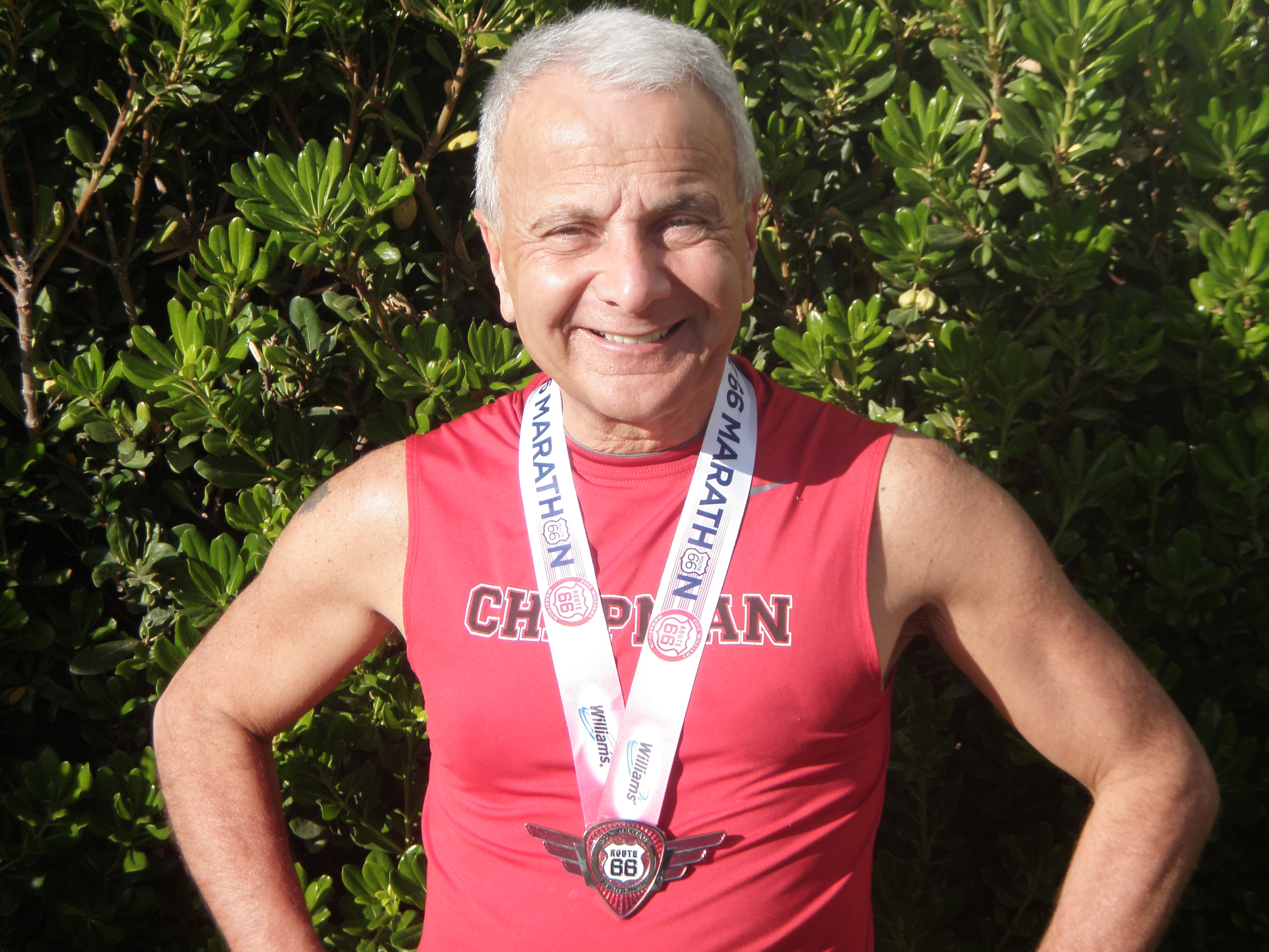 President Jim Doti displays the distinctive medal from the Williams Route 66 marathon.