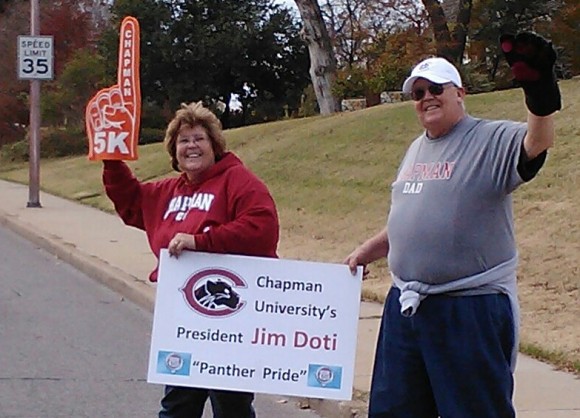 Chapman parents and Oklahoma residents Susan and Mike Bass surprised President Doti with a boost of Panther Pride during the Williams Route 66 Marathon.
