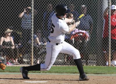 Chapman junior Connor Battaglia (No.25) connects for a hit in Champion's first win