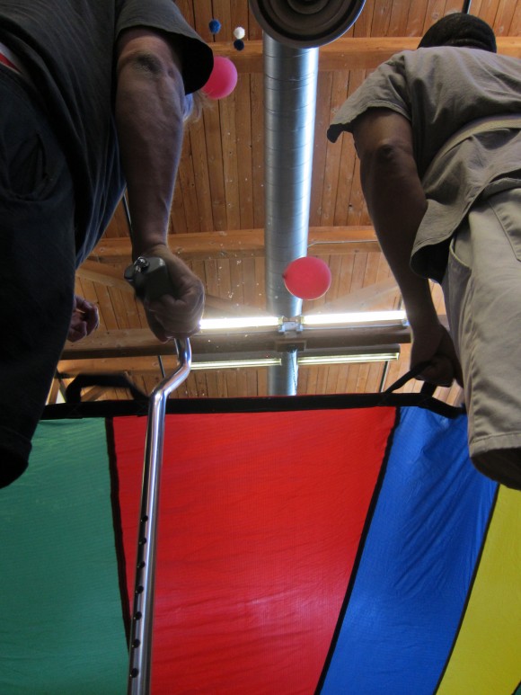 A colorful parachute and a handful of balloons become tools of recovery at Chapman’s Stroke Boot Camp.