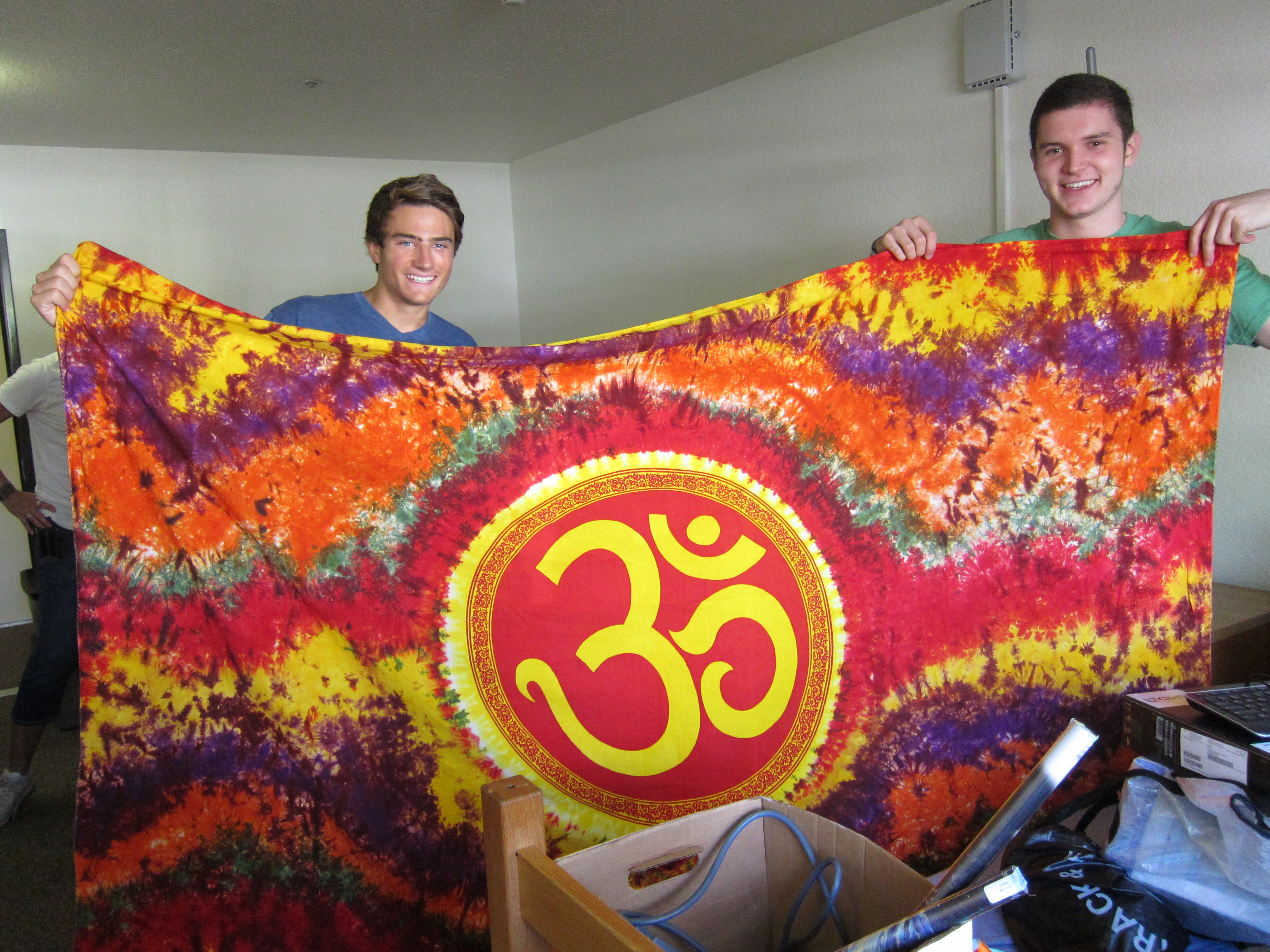 Connor Reed, right, of Placerville, and roommate Sam Baldridge display Reed's om tapestry he brought from home.