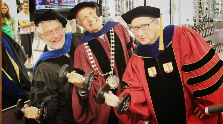 Chancellor Danielle Struppa, Presidnet Jim Doti and Associate Vice Chancellor Jerry Price check out the new equipment in the Julianne Argyros Fitness Center immediately following Convocation 2013. Don't fret -- the new dress code does not require caps and gowns.
