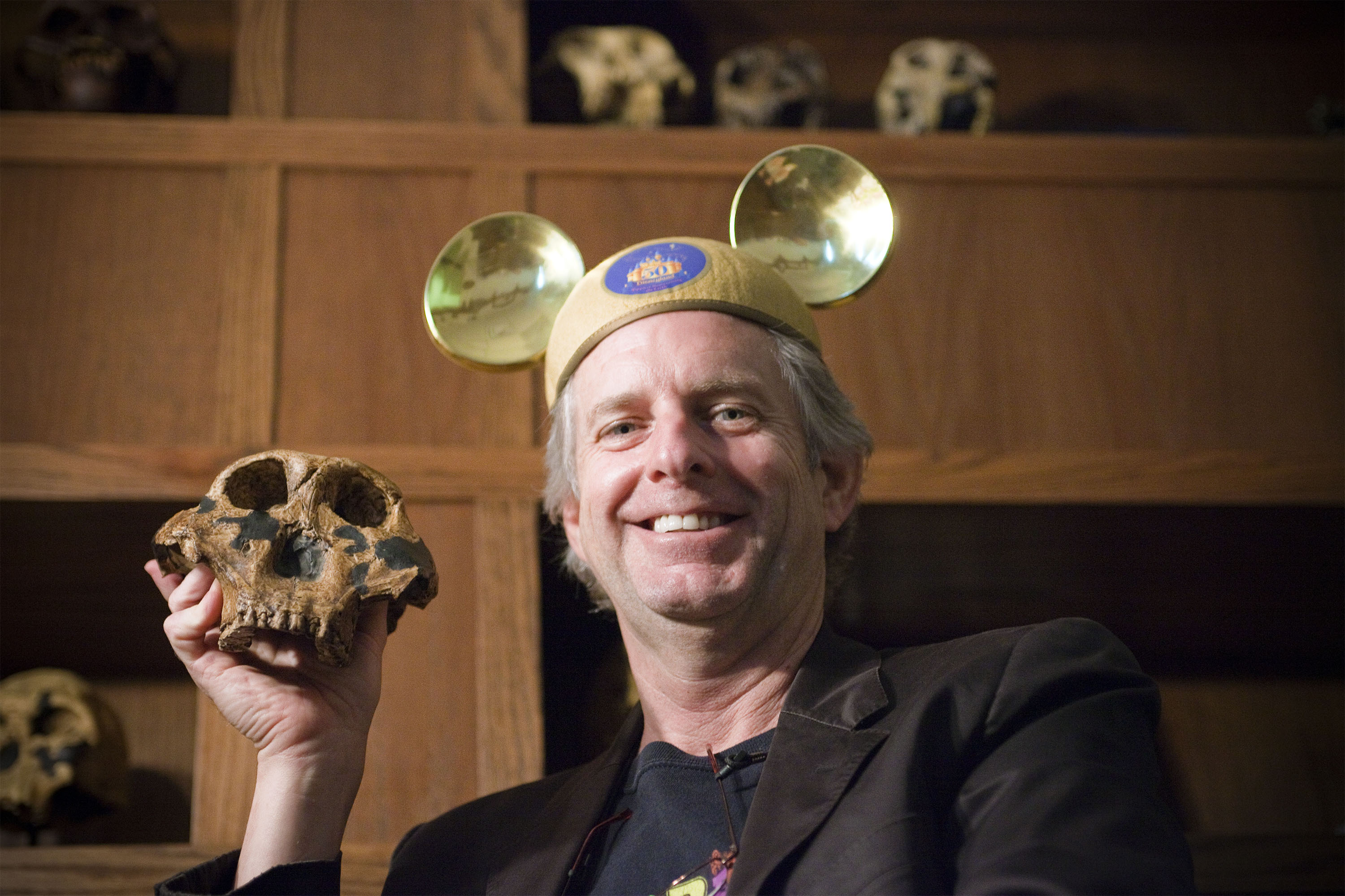 man with mickey mouse hat