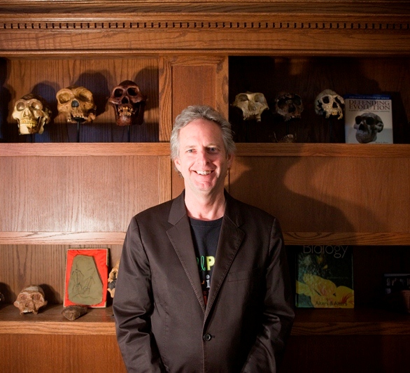 man smiling with skulls