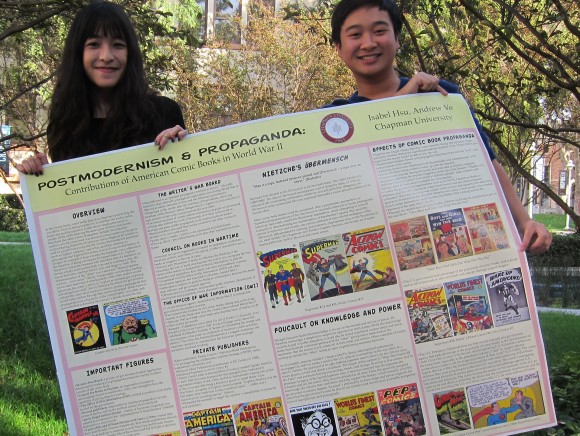 students holding research sign