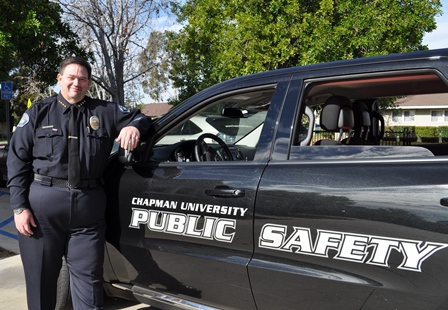 public safety officer standing next to car