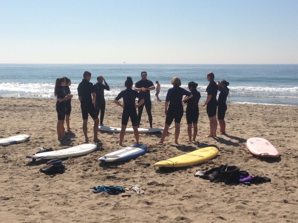 Chapman University students enrolled in FCC-100 The Surfing Industry take a professional surf lesson as part of the class requirements.