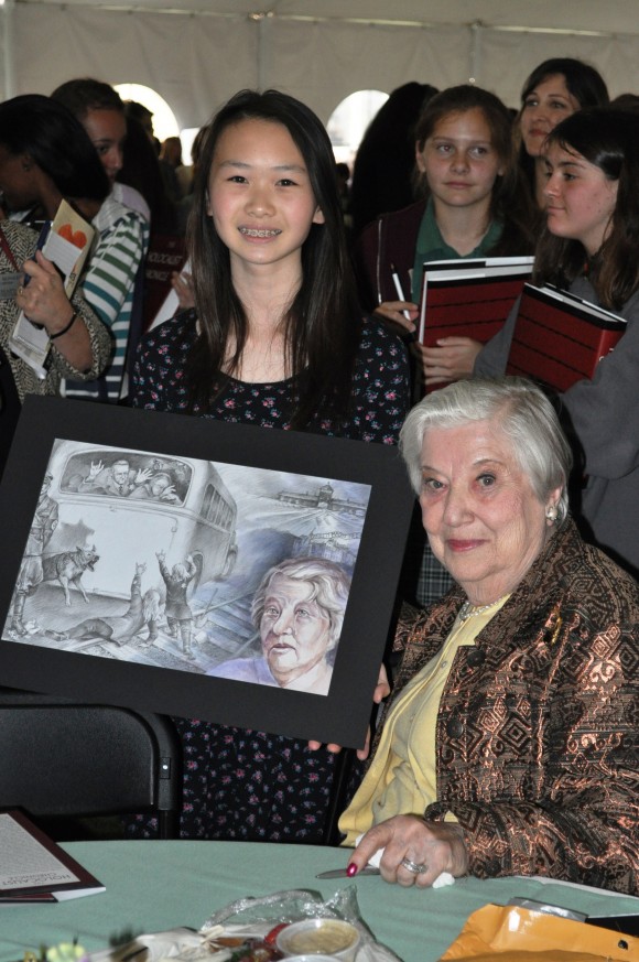 women holding artwork