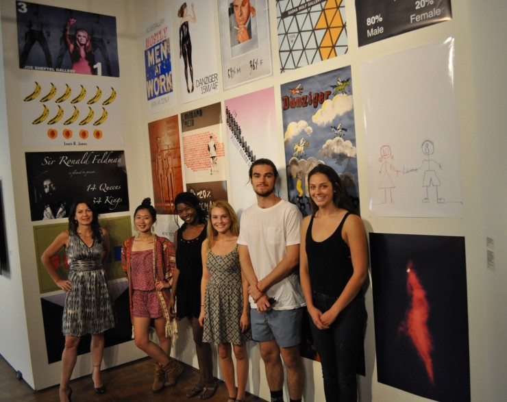 students by wall of posters