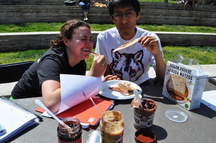 Environmental science major Danielle Platt '17 and digital arts major Stephen Levin '15 get a taste of Matzah in the Piazza today, one of several campus events planned to mark Passover and Holy Week.