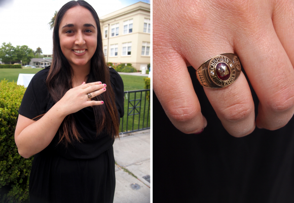 student smiling with class ring
