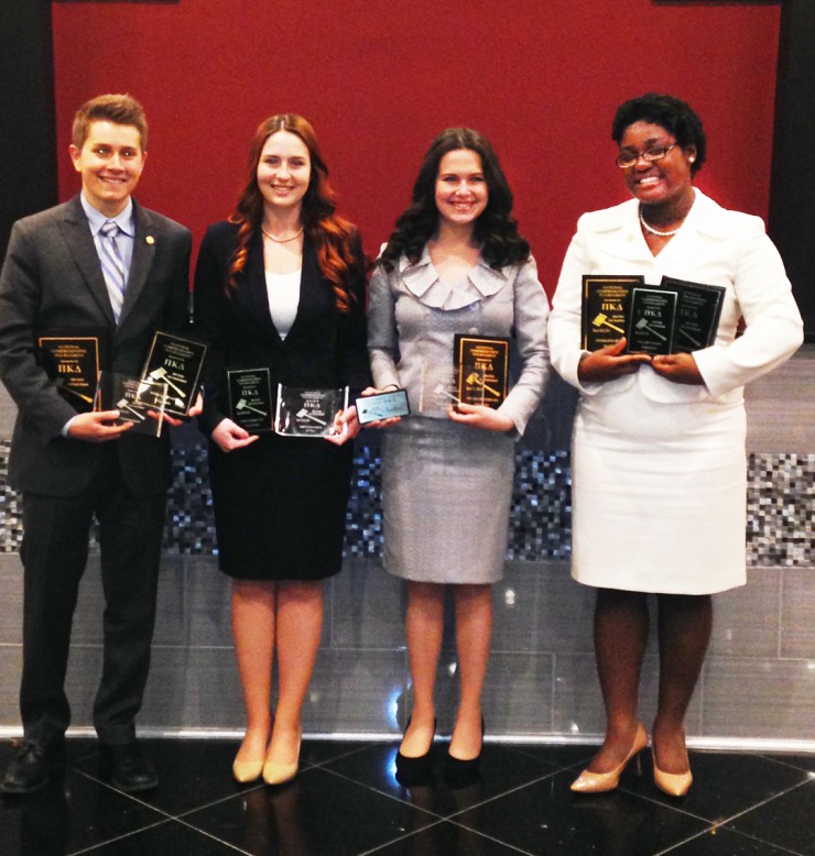 Chapman speech and debate team members with their awards from the Pi Kappa Delta National Tournament, held March 20-24, in Indianapolis, Ind., include, from left, Timothy Seavey, Katie Henderson, Shelby Stanton and Jasmine Johnson.