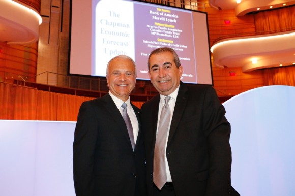 President Jim Doti, left, and Esmael Adibi, director of the Anderson Center for Economic Research, presented the 2014 economic forecast update at The Segerstrom Center for the Arts.