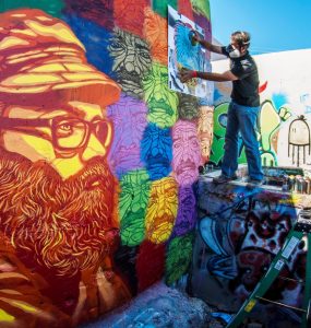 artist painting a mural