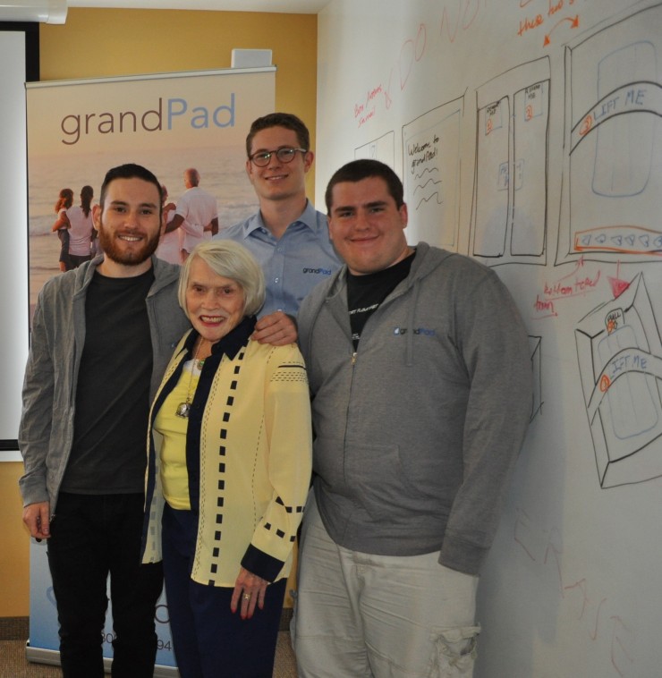 Margaret Silbar visited Launch Pad recently to see where the students worked to create grandPad. From left are Silbar's grandson Ryan Burns '14, Isaac Lien '17 and David Tyler '14.
