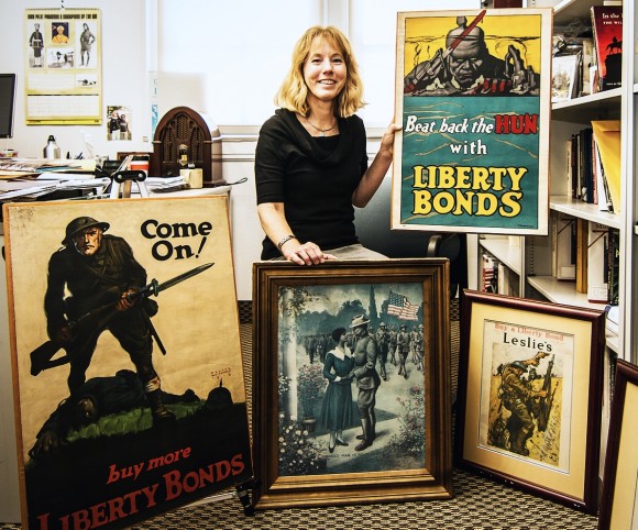 History professor Jennifer Keene displays images from her World War I collection. Keene is scheduled to be the first speaker in the 2014-15 Lunch at the Forum series. (Photo by Scott Stedman ’14.)