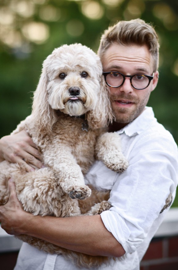 man holding a dog