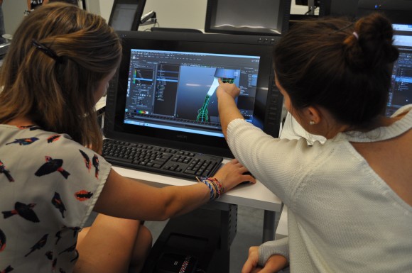 Jennifer Re '15 offers a suggestion to Taylor Reynolds '17 as she works on an animation project.