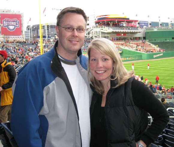 man and woman at baseball game