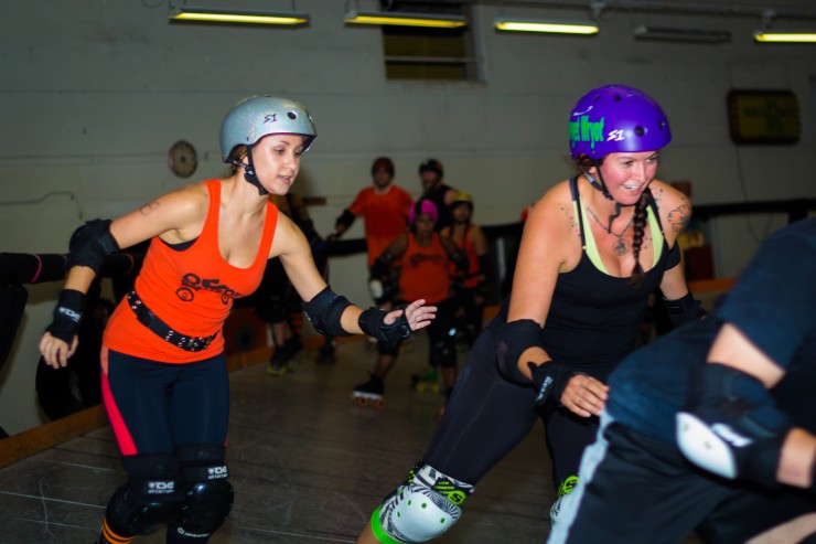 Linda Freedkin, far left, moves toward an opening in a drill challenging jammers to break through a pack of opponents.