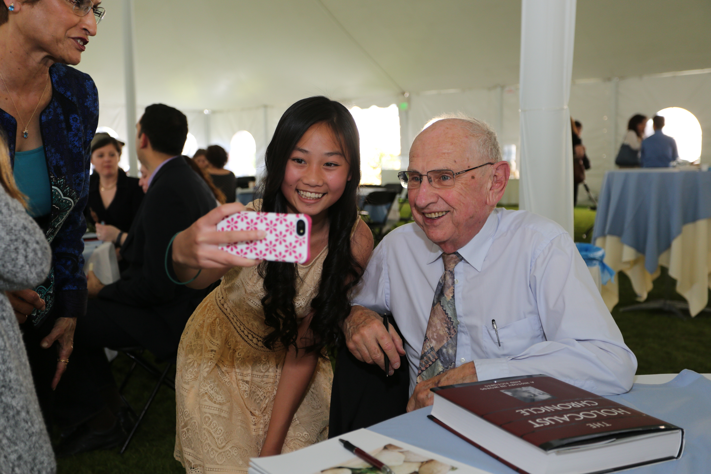 man taking a picture with woman