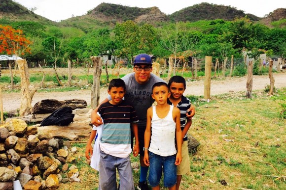 student with children in Honduras