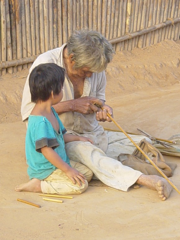 tsimane elder helping child