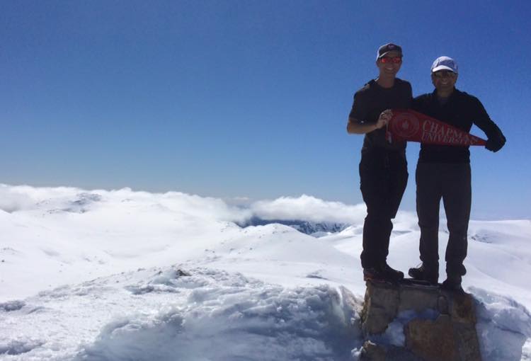 Father and son conquer the peaks: Adam and Jim Doti on the summit of Australia's highest peak, Mt. Kosciuszko, just days after summitting the Carstensz Pyramid, the highest peak in Southeast Asia.