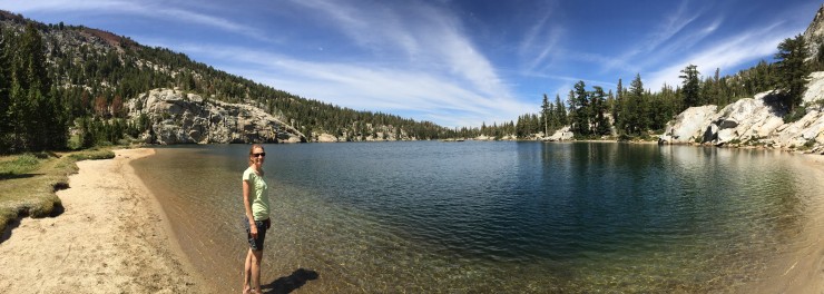 Woman standing in front of a lake