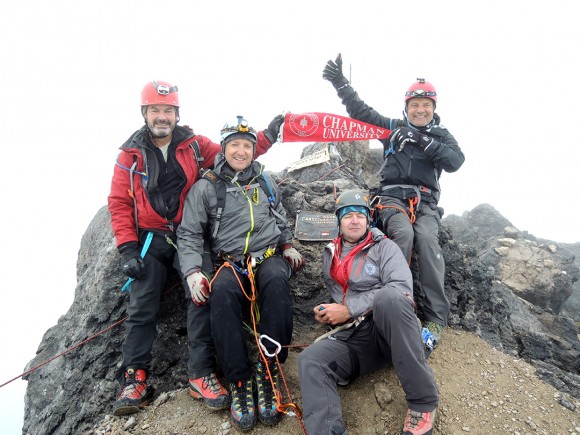The expedition group and the Chapman pennant on top of the Carstensz Pyramid.