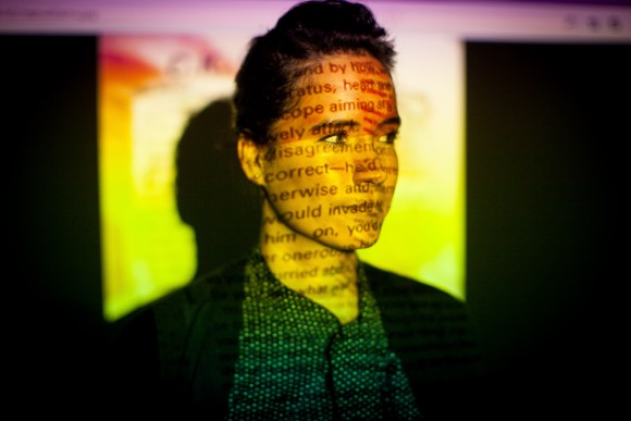 woman smiling with projected image on her face