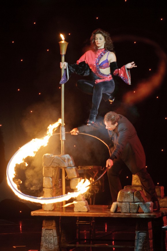 man and woman on stage with fire