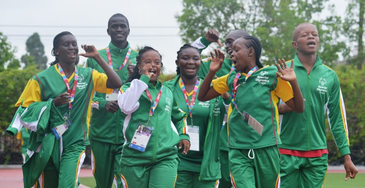 group of athletes wearing green