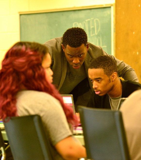 two men looking at computer screen