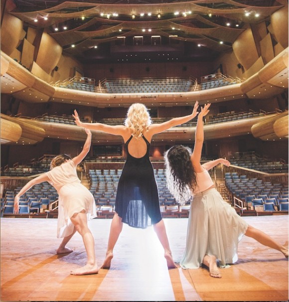 three women dancing on stage