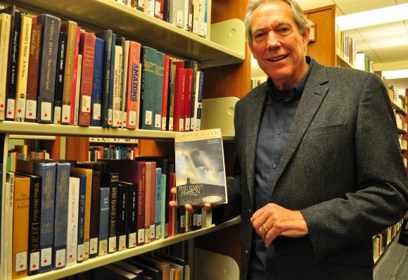 man smiling in library