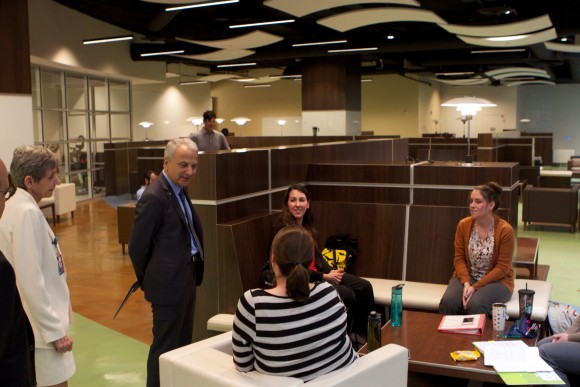 President Doti visits with students gathered in the Rinker Campus lounge.