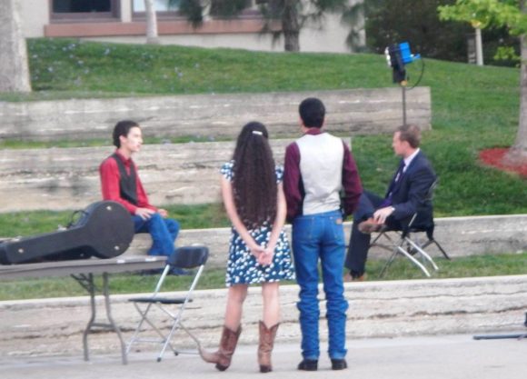 students watch an interview