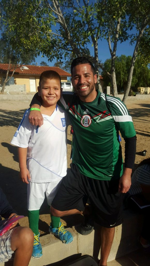 Young boy and man smiling