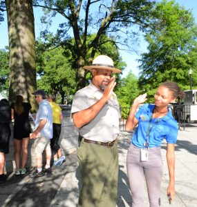 Leah Thomas '17 high-fives a park ranger during her time at President's Park in D.C.