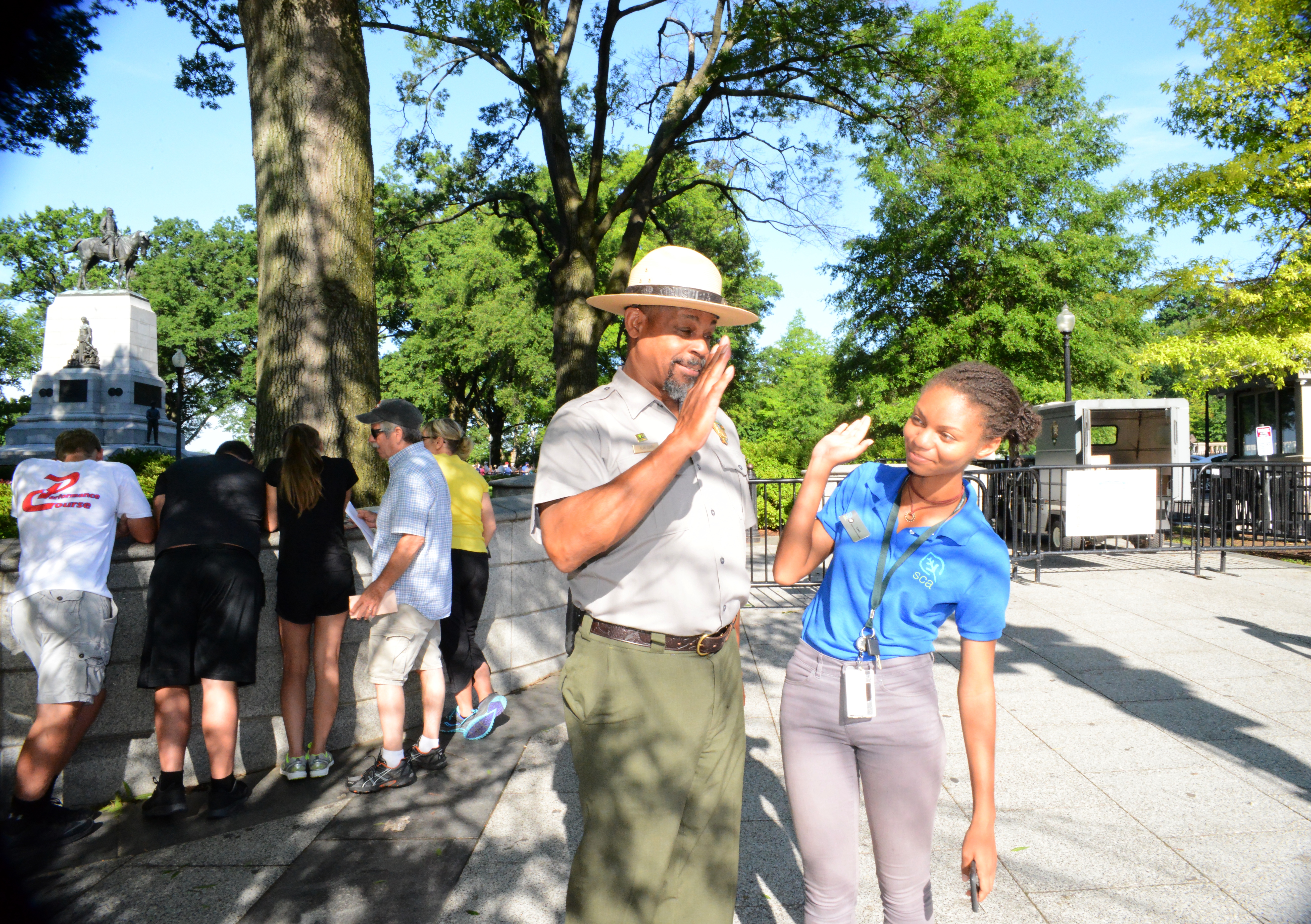 Leah Thomas '17 high-fives a park ranger during her time at President's Park in D.C.
