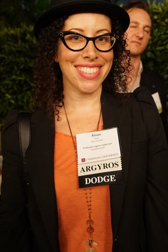 Smiling woman with glasses in hat